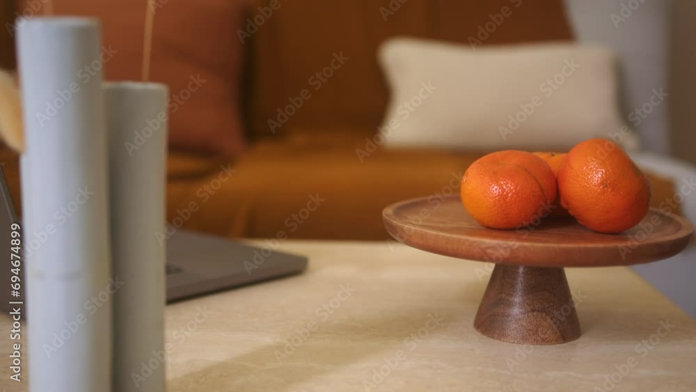 Oranges on Wooden Stand with Tall Vases and Laptop Oranges on Wooden Stand with Tall Vases and Laptop