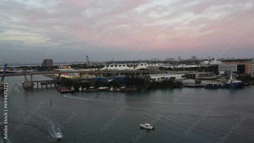 Drawbridge Over Biscayne Bay In Miami Florida; Small Yachts Sunset Cruising Along The Busy Waterways Of Downtown Miami. Drawbridge Over Biscayne Bay In Miami Florida; Small Yachts Sunset Cruising Along The Busy Waterways Of Downtown Miami.