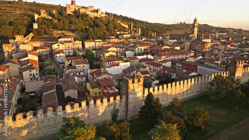 Medieval Scaliger Turreted Walls In Soave Town During Golden Hour In Northern Italy. - aerial shot
 photo
