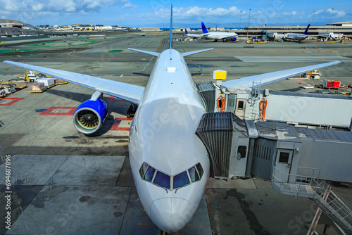 Obraz na płótnie Passenger aircraft parked at the gate, waiting to be loaded at the San Francisco International Airport, SFO