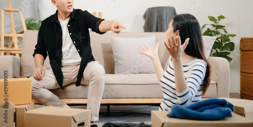 Divorce. Asian couples are desperate and disappointed after marriage. Husband and wife are sad, upset and frustrated after quarrels. family problem, teenage love. on sofa photo