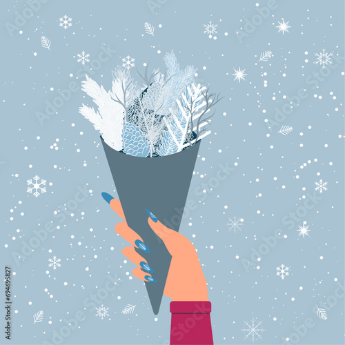 vector winter bouquet with branches and pine cones. a bouquet of branches in hand with a winter manicure on a background with snowflakes