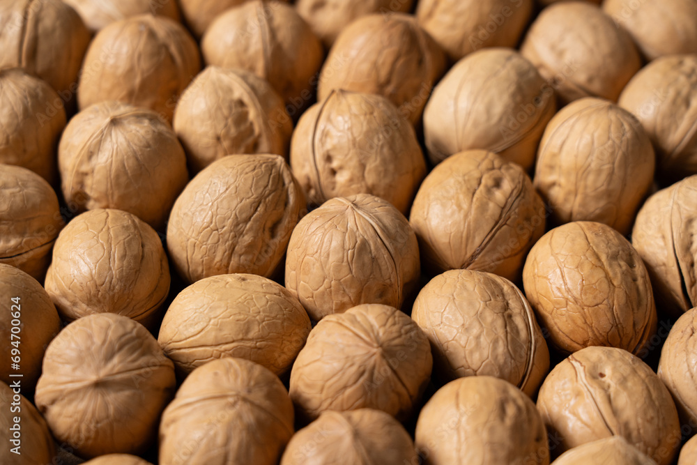 closeup of ripe walnuts texture background. closeup of ripe walnuts texture background.