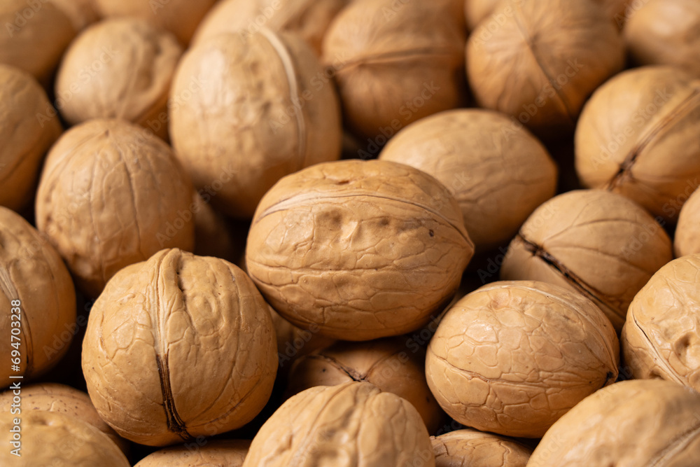 closeup of ripe walnuts texture background. closeup of ripe walnuts texture background.