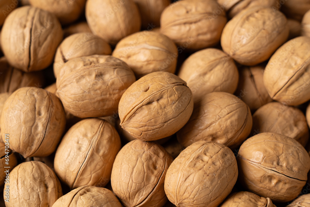 closeup of ripe walnuts texture background. closeup of ripe walnuts texture background.