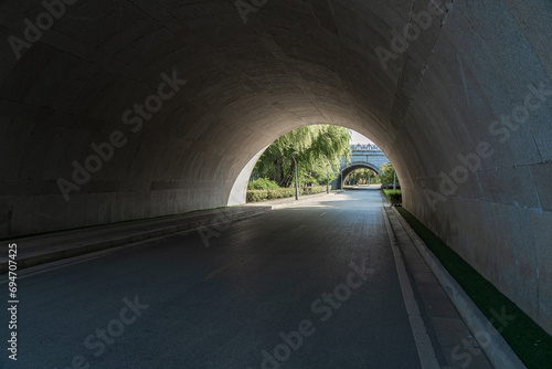 The road under a modern bridge