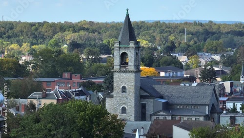 Church bell tower in old American town. Aerial view. photo