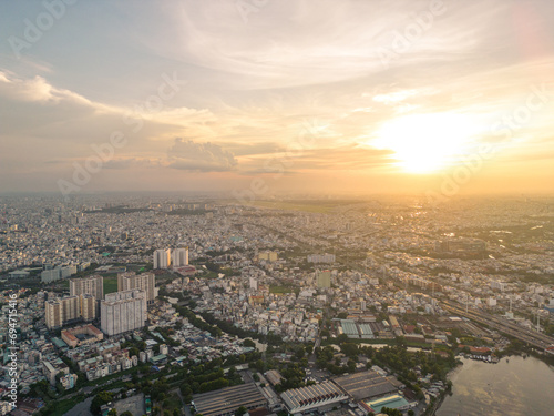 Panoramic view of Saigon  Vietnam from above at Ho Chi Minh City s central business district. Cityscape and many buildings  local houses  bridges  rivers