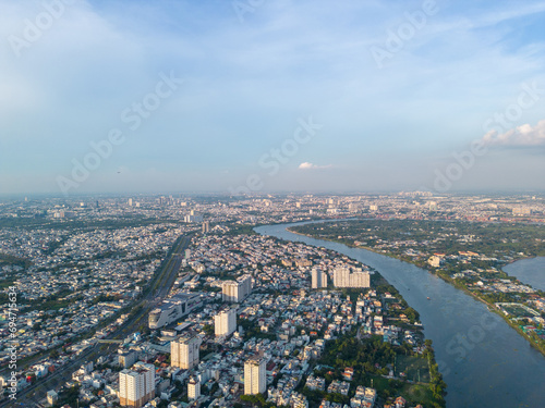 Wallpaper Mural Panoramic view of Saigon, Vietnam from above at Ho Chi Minh City's central business district. Cityscape and many buildings, local houses, bridges, rivers Torontodigital.ca