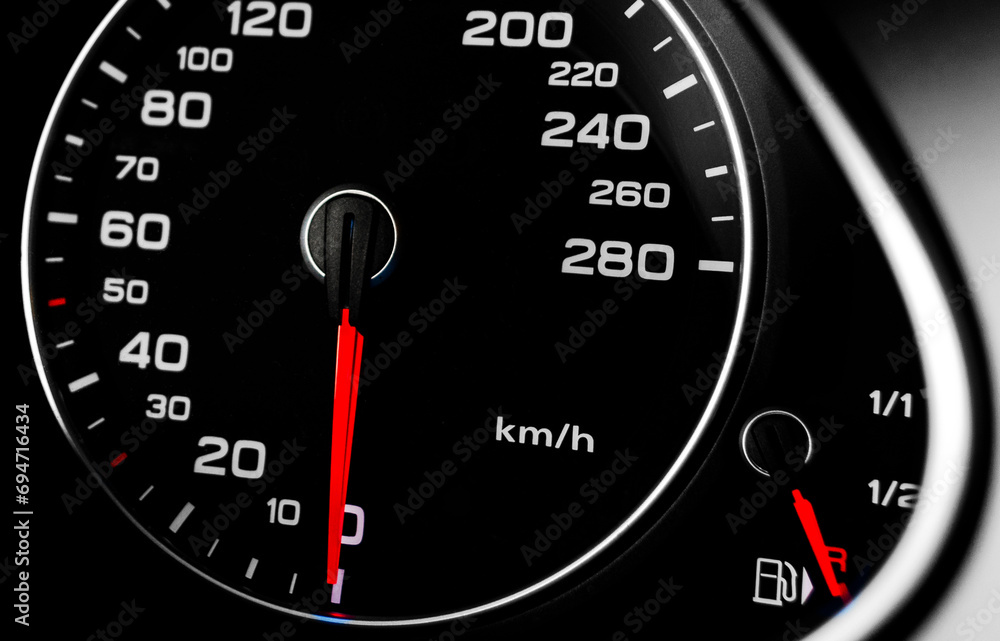 Close up shot of a speedometer in a car. Car dashboard. Dashboard details with indication lamps. Car instrument panel.