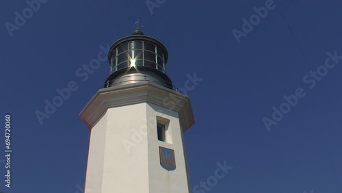 The top of the Snake Island lighthouse, viewed from below and from the side. Black Sea, Ukraine. photo