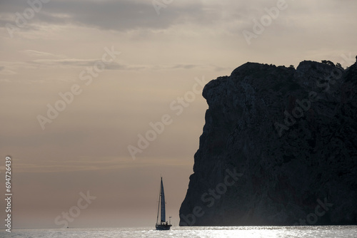 sailing ship passing Cabo de Formentor, Tramuntana coast, Pollensa, Majorca, Balearic Islands, Spain photo