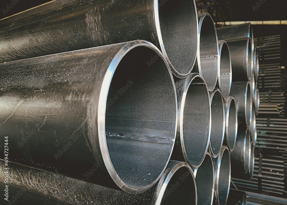 Steel pipes are placed in factory, steel pipe for fabrication,Stacked together of steel tube, close-up.steel pipes in in warehouses awaiting delivery.at thailand Steel pipes are placed in factory, steel pipe for fabrication,Stacked together of steel tube, close-up.steel pipes in in warehouses awaiting delivery.at thailand