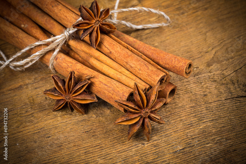 Close up of cinnamon sticks and star anise on wood