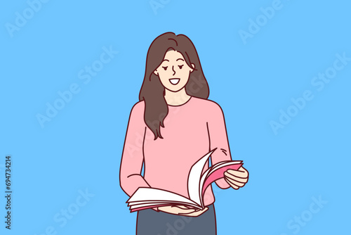 Woman stands with magazine in hands and flips through pages publication to learn about style trends. Girl studies weekly issue magazine or tabloid with yellow news about lives of show business stars