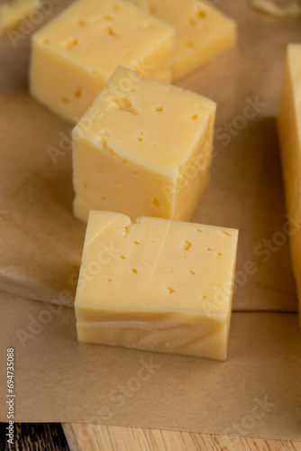 yellow semi-hard cheese with holes