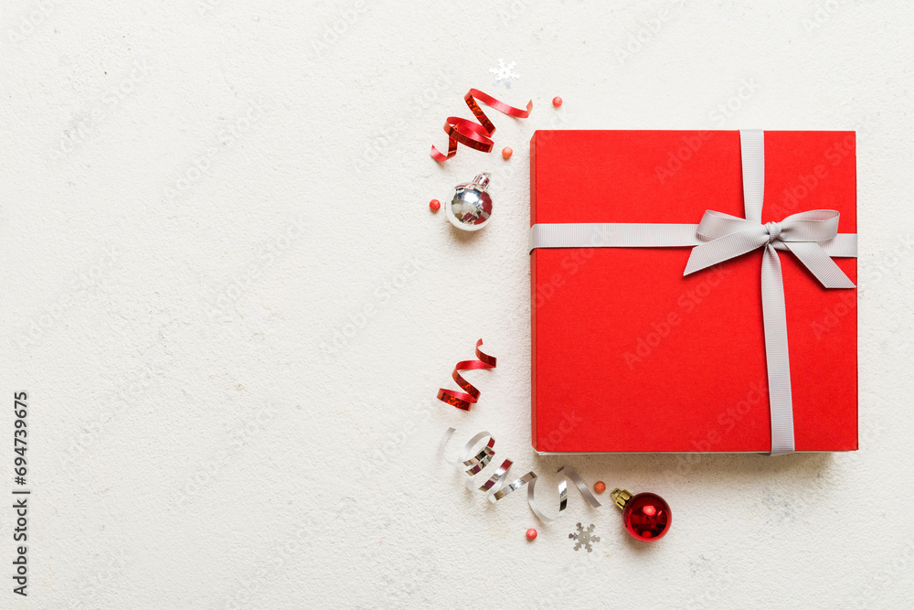 Top view Flat lay Christmas decorations and gift box on colored background with copy space. Christmas or Happy New Year composition Top view Flat lay Christmas decorations and gift box on colored background with copy space. Christmas or Happy New Year composition