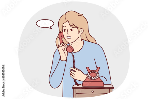 Young woman speak on old corded phone at home. Female have conversation on landline telephone. Communication and call. Vector illustration.