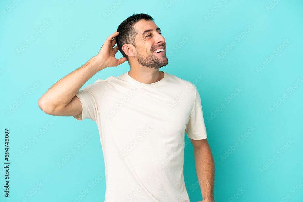 Young handsome caucasian man isolated on blue background smiling a lot Young handsome caucasian man isolated on blue background smiling a lot