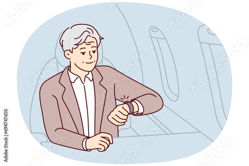 Mature rich man sit in airplane looking at wristwatch being in rush. Elderly male in business class of plane worried about miss deadline. Vector illustration.