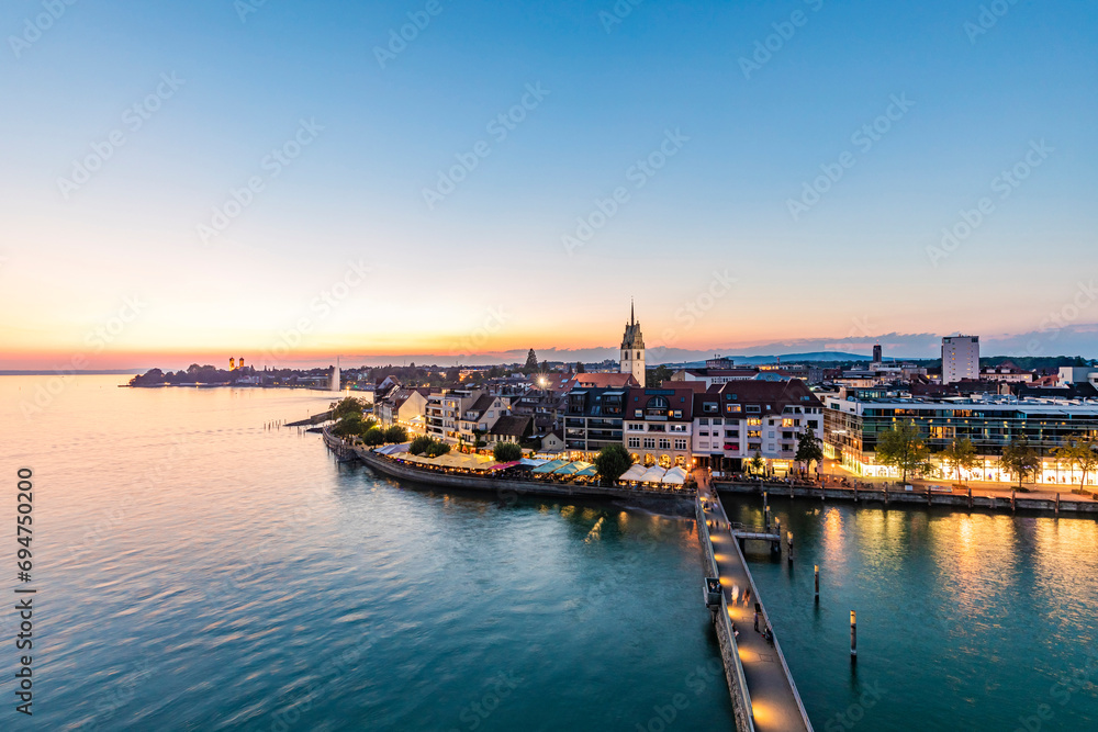 Germany, Baden-Wurttemberg, Friedrichshafen, Waterfront of city on shore of lake Bodensee at dawn Germany, Baden-Wurttemberg, Friedrichshafen, Waterfront of city on shore of lake Bodensee at dawn