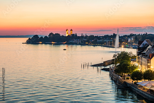 Germany, Baden-Wurttemberg, Friedrichshafen, Coastline of city on shore of lake Bodensee at dawn photo