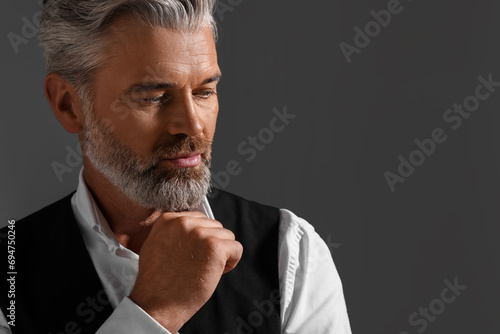 Bilde på lerret Portrait of confident man with beautiful hairstyle on dark background