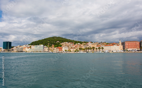 The waterfront of the historic coastal city of Split in Dalmatia, Croatia. Marjan Hill is centre left and the Church and Convent of St Francis far right photo