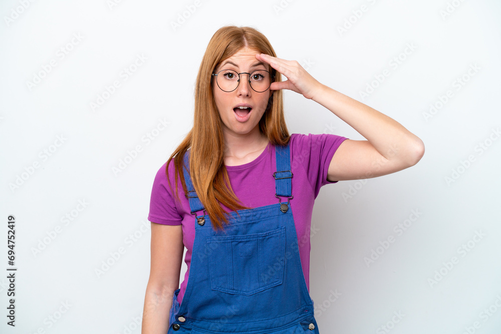 Young redhead woman isolated on white background has realized something and intending the solution Young redhead woman isolated on white background has realized something and intending the solution