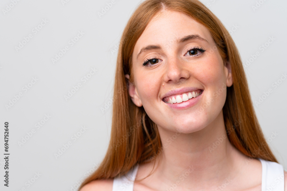 Portrait of pretty redhead woman over isolated white background Portrait of pretty redhead woman over isolated white background