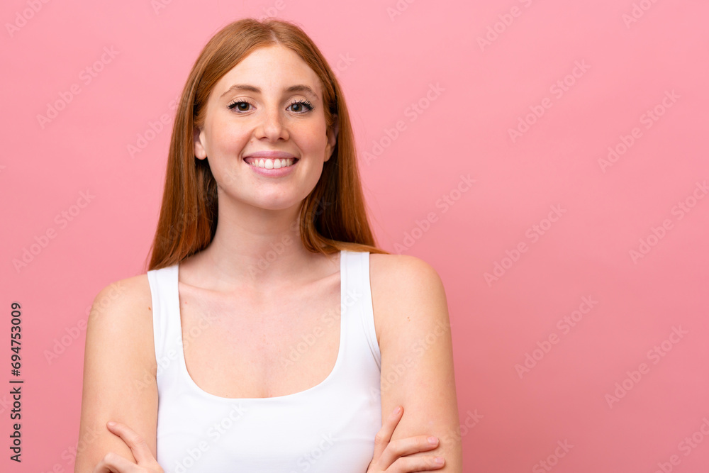 Young redhead woman isolated on pink background Young redhead woman isolated on pink background