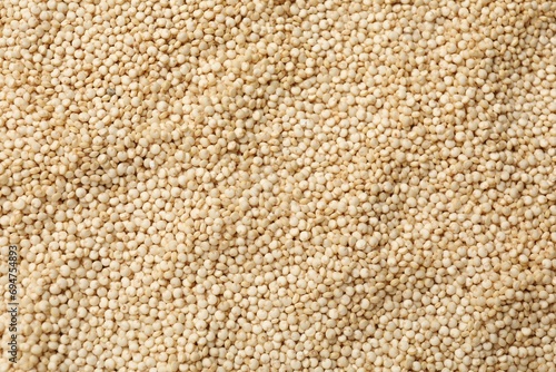 Raw quinoa seeds as background, top view