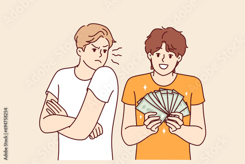 Man is jealous of rich friend showing off money bills earned in business or won in casino. Rich guy does not pay attention to poor person experiencing discomfort due to social inequality