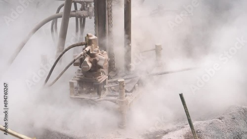 Harvesting Vitality Bore Well Drilling in an Indian Town, Drilling a bore well for water in the Indian town, Water well drilling rig preparing to boring dowin into the earth stock video photo