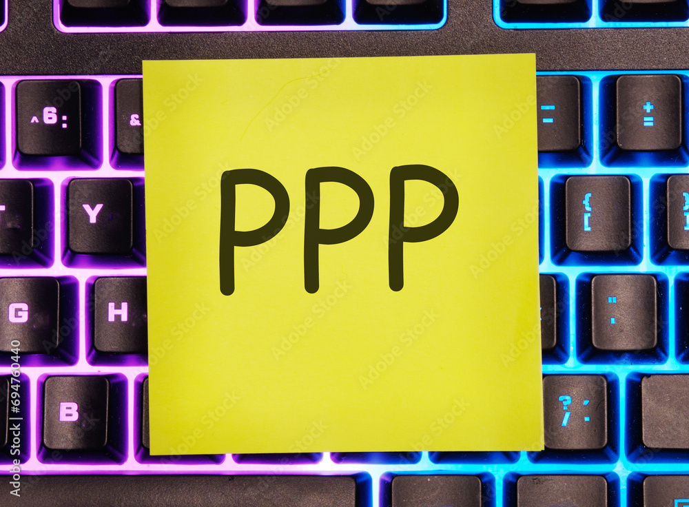 Paycheck Protection Program PPP written on a yellow sticker on a laptop keyboard with backlight