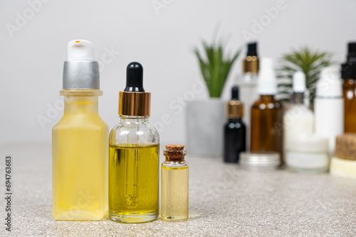 Natural oils for hair and skin care. Cosmetics in glass jars  eco-friendly products.
