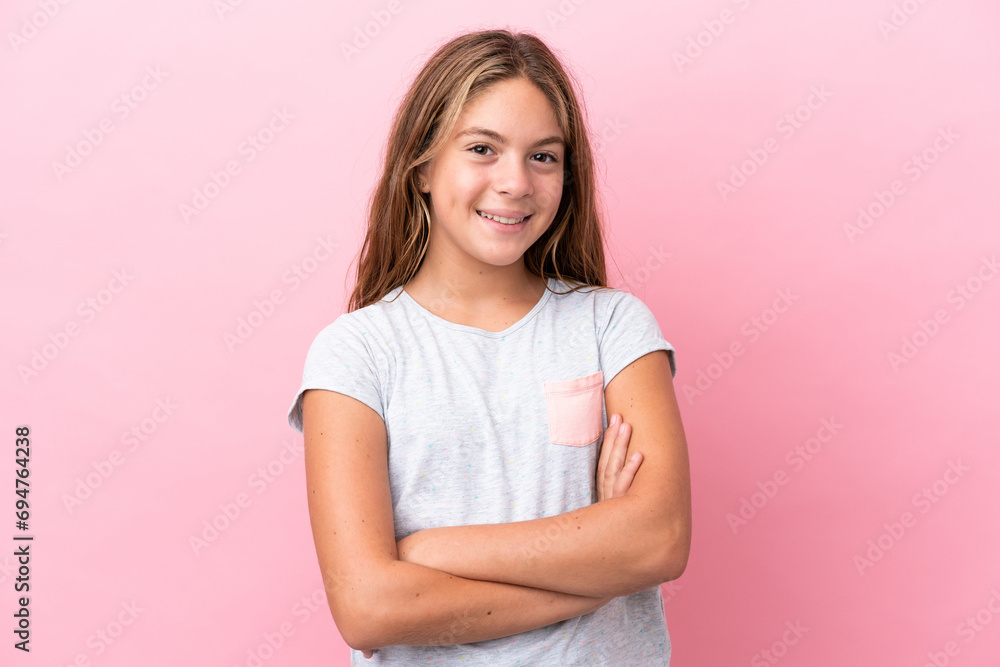 Little caucasian girl isolated on pink background keeping the arms crossed in frontal position Little caucasian girl isolated on pink background keeping the arms crossed in frontal position