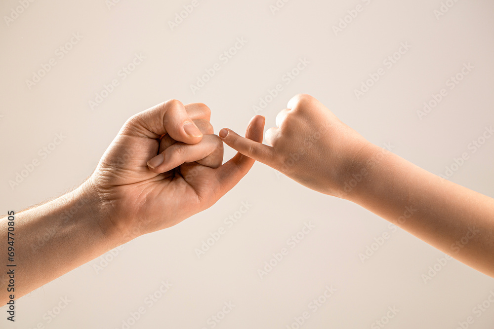 Little finger of the two hands hold together. Show friendship and ...