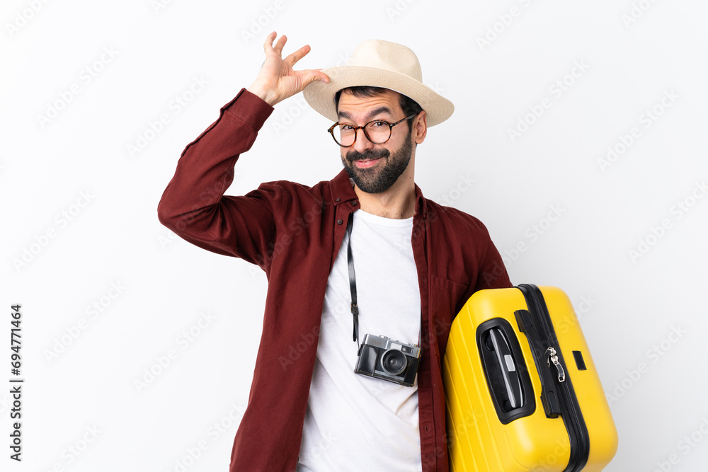 Traveler man man with beard holding a suitcase over isolated white background Traveler man man with beard holding a suitcase over isolated white background