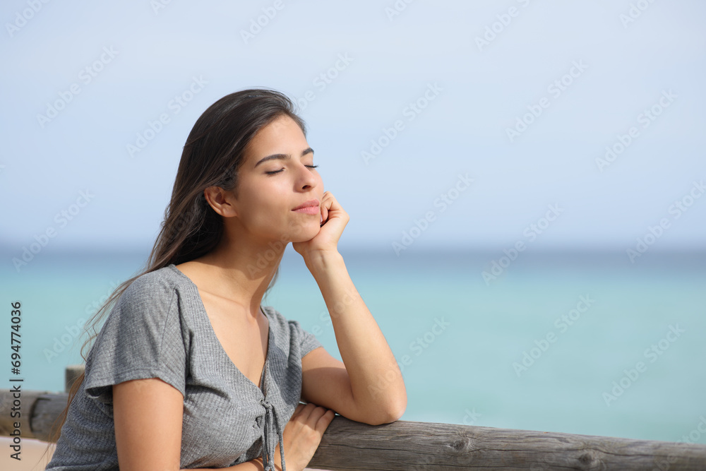 Woman resting on the beach relaxing alone