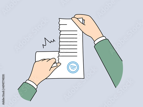 Hands tear up sealed contract to get rid of non-income-generating business obligations or quit job. Person destroys legal documents that could indicate criminal actions of business or corporation.
