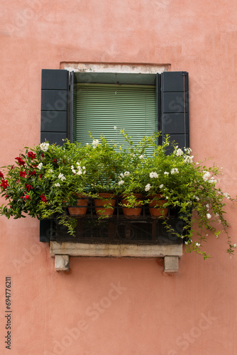 beautiful window with fresh home flowers in Venice