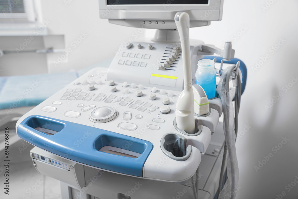 Ultrasound control panel with ultrasonic transducers and transmission gel indoors, closeup. Medical equipment Ultrasound control panel with ultrasonic transducers and transmission gel indoors, closeup. Medical equipment