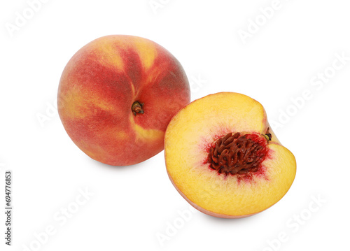 Whole and cut delicious peaches isolated on white