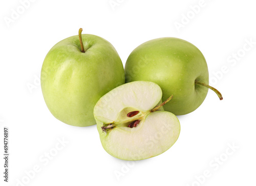 Whole and cut green apples isolated on white