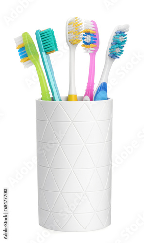 Different toothbrushes in holder isolated on white