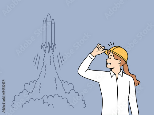 Woman engineer stands near taking off space rocket and watches successful takeoff of shuttle. Girl rejoices at launch of new spacecraft or rocket for research mission with astronauts landing on moon