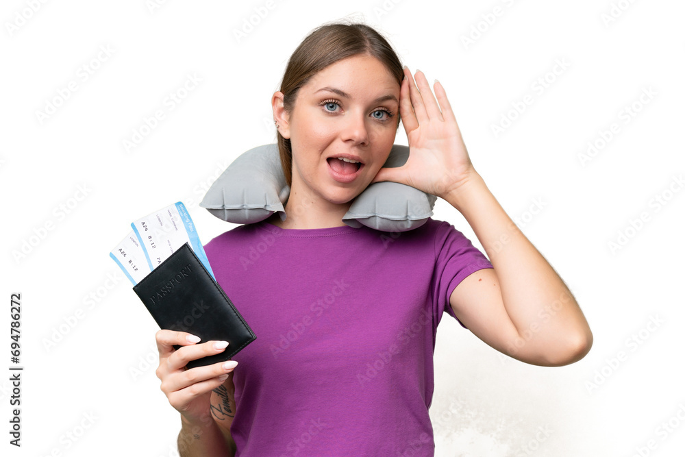 Young beautiful blonde woman with Inflatable travel Pillow over isolated background with surprise expression Young beautiful blonde woman with Inflatable travel Pillow over isolated background with surprise expression