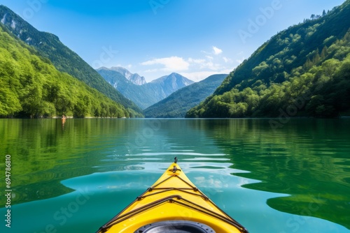 Kayaking adventure on a serene lake surrounded by green mountains, Generative AI © ManusiaIkan