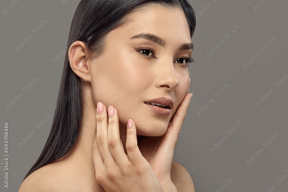 Beauty woman touching her face with hands enjoying soft smooth skin. Beauty woman touching her face with hands enjoying soft smooth skin.